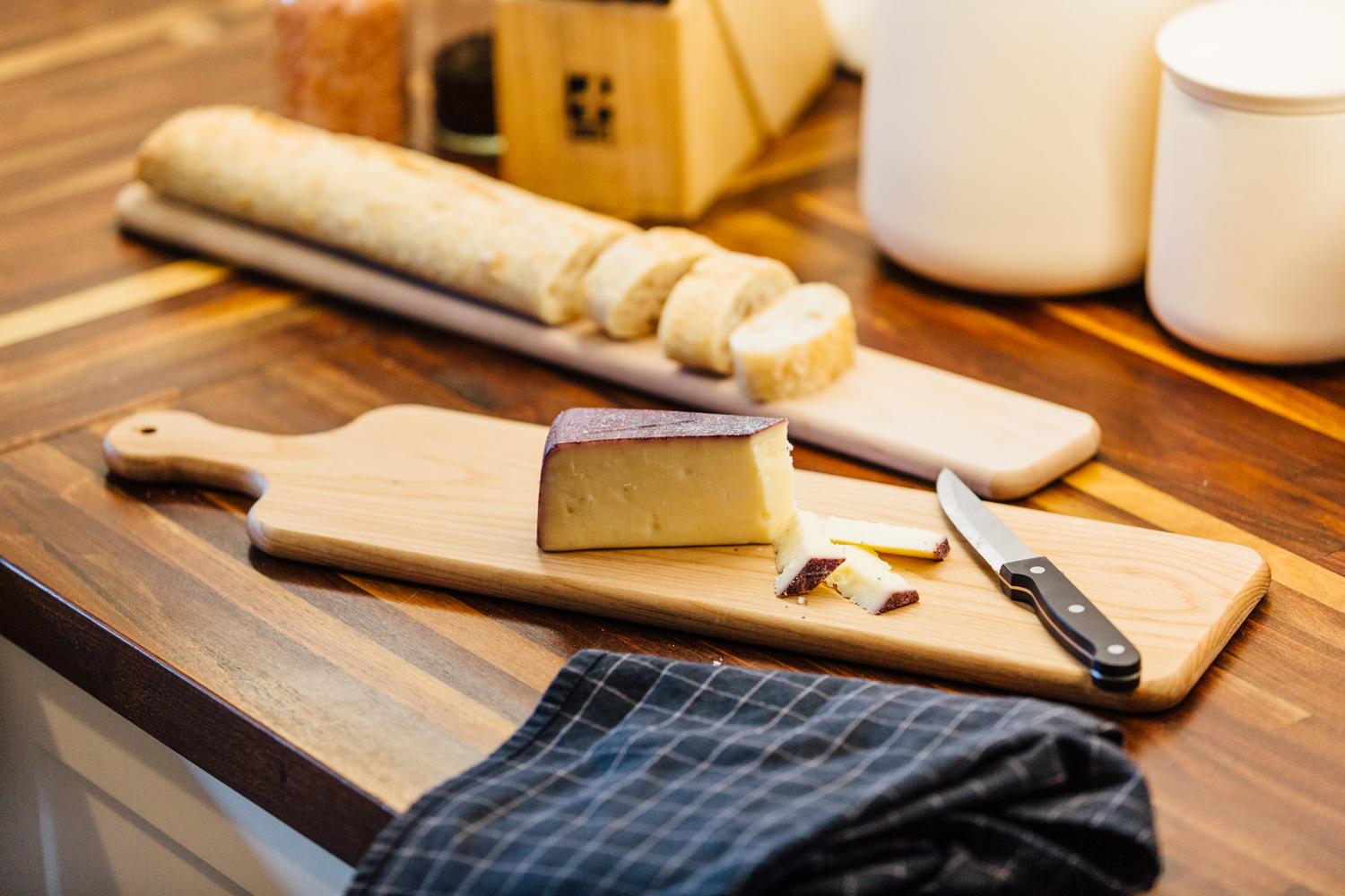 Lifestyle shot of cheese on a cutting board