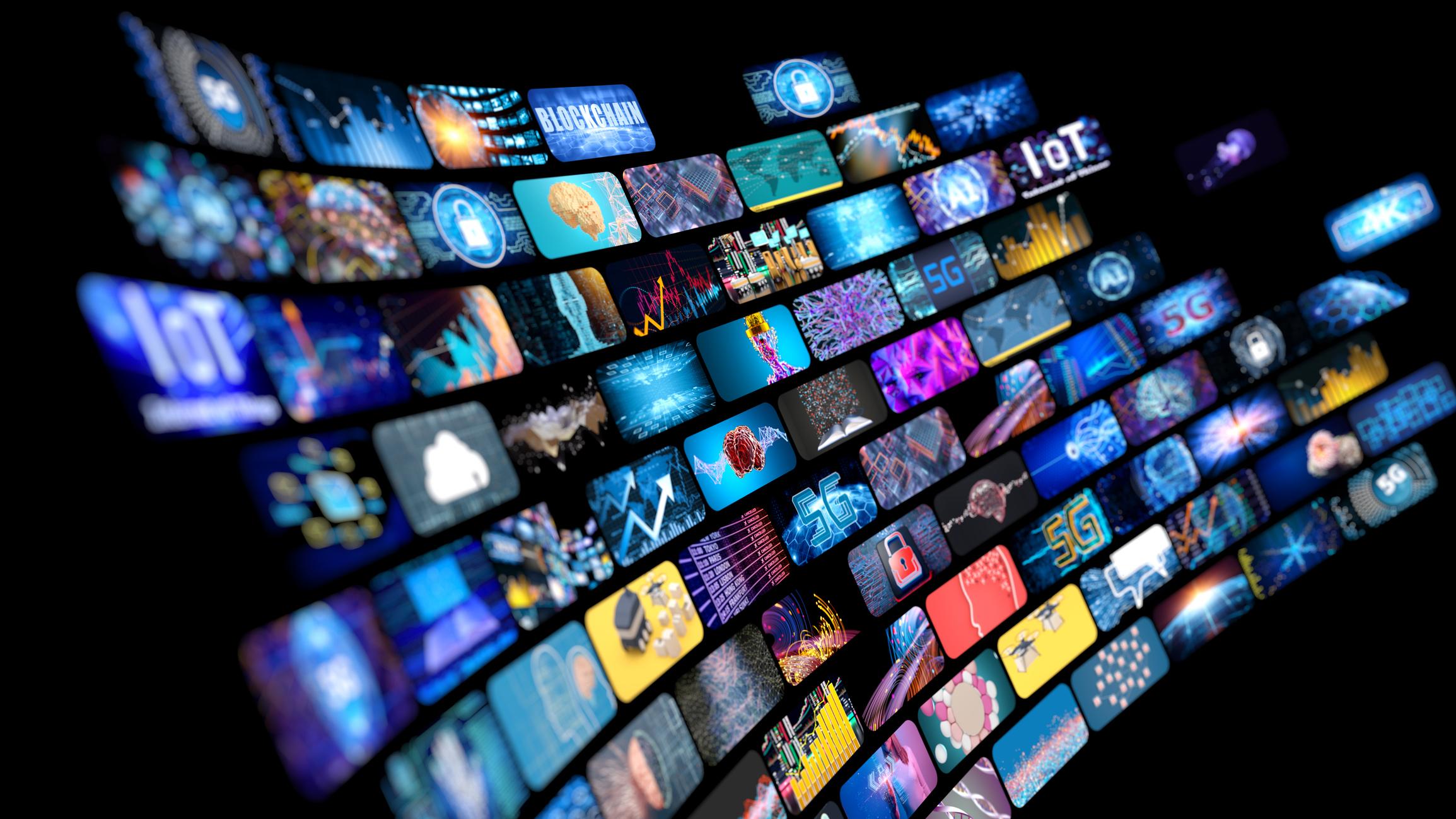 Multiple television screens on a black background