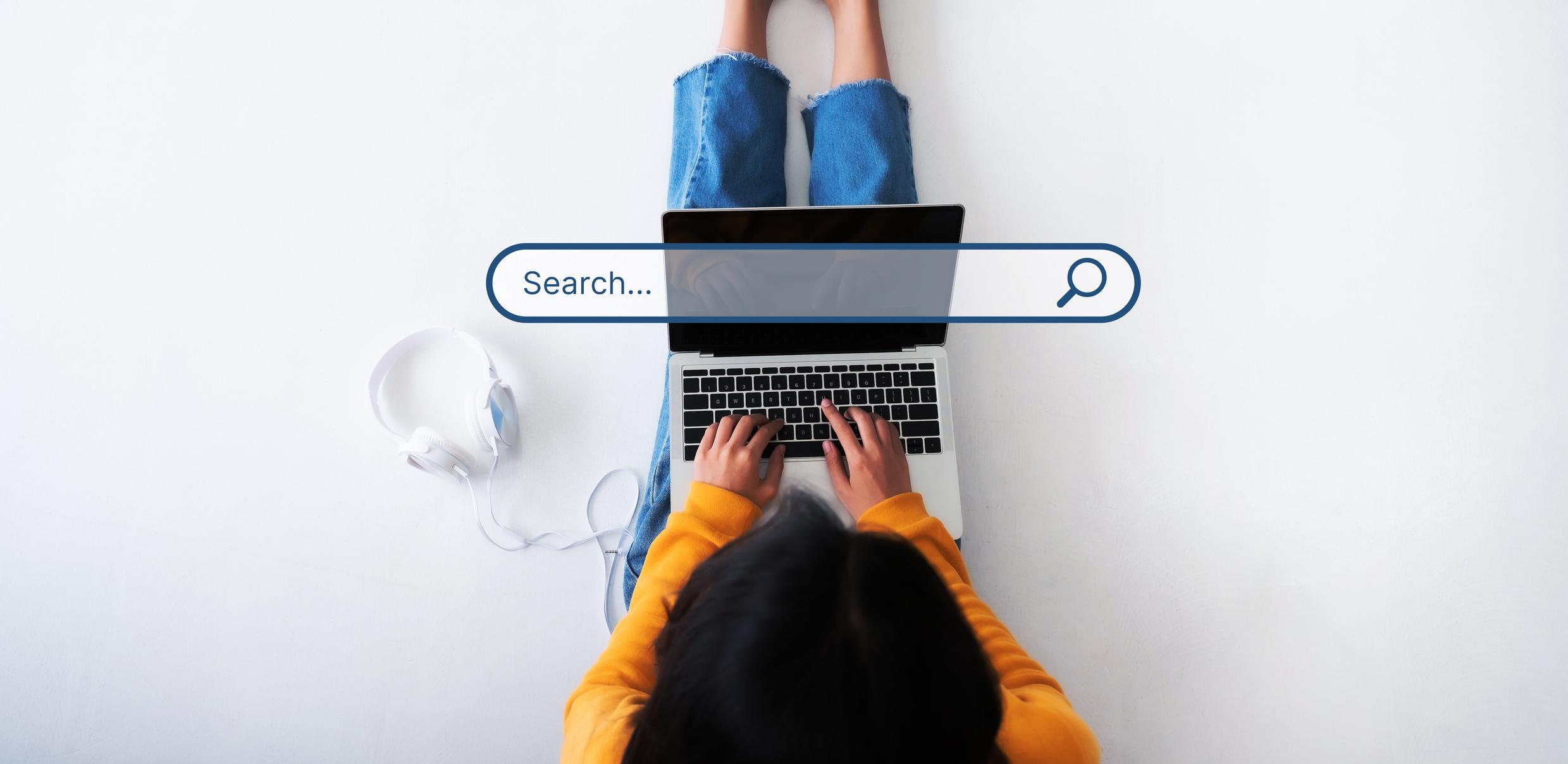Top view of a women using a laptop to searching data on the internet
