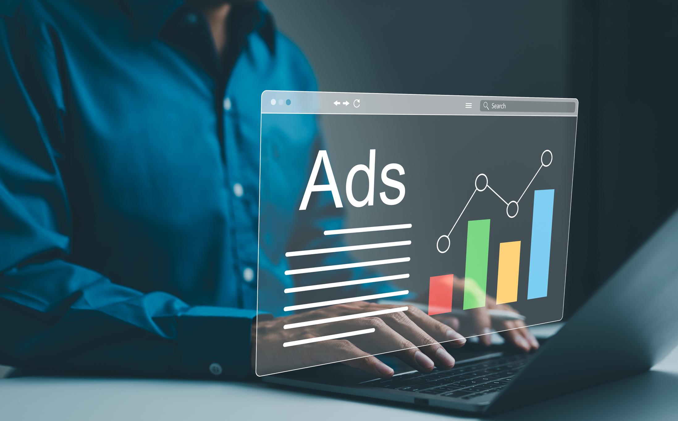 Business owner working on digital ads at a laptop